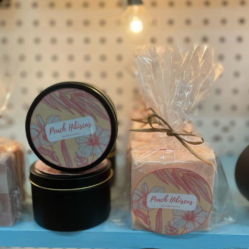 Two local candle wax blocks posed against a shelf.